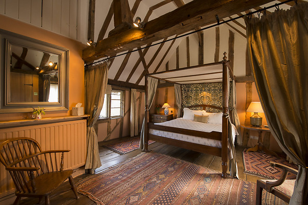 A beautiful antique four poster bed in Mint Cottage in Lavenham