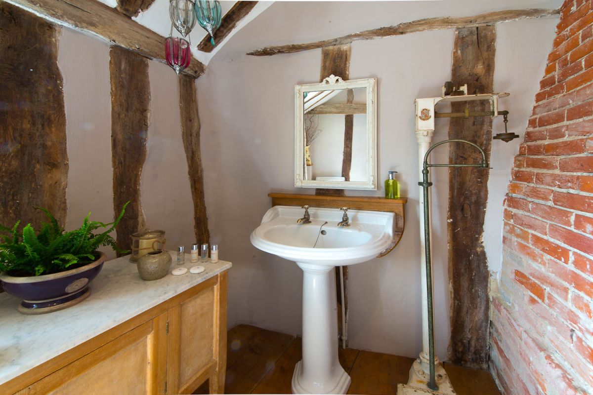 a pretty bathroom in a romantic cottage