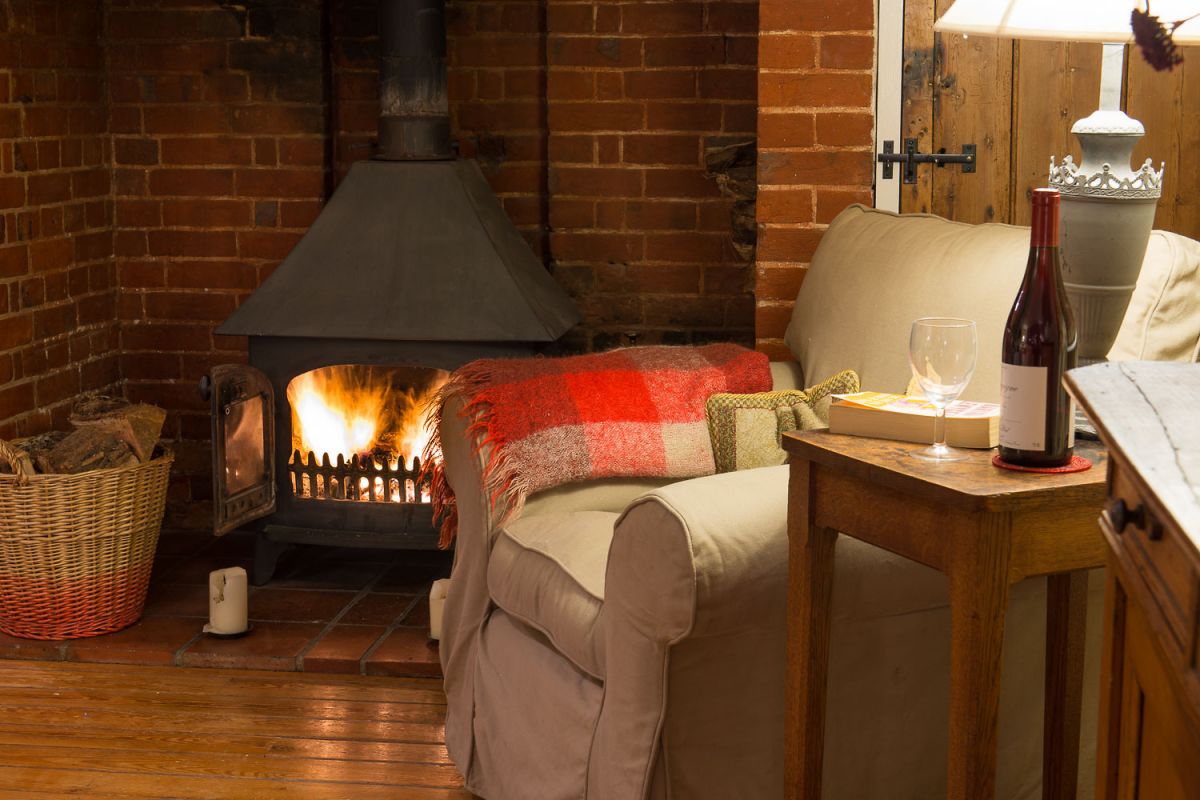 Open log fire in Suffolk cottages